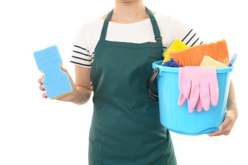 Technician treating fabric furniture during upholstery cleaning in Kenton